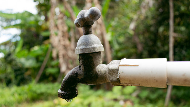 Outdoor faucet with a water drop coming out