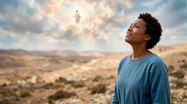 Black woman looking up at the sky witnessing the second coming of Jesus Christ. Happy Christian female believer watching biblical prophecy in desert landscape. Spiritual faith and hope concept