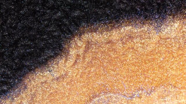 Mixing alcohol ink in macro view shows vibrant colors and patterns