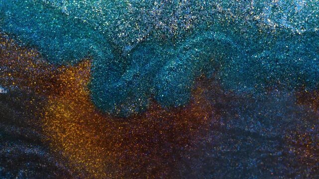 Mixing of alcohol ink in macro view showing vibrant textures and patterns