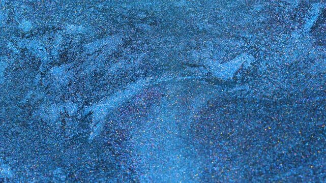 Mixing alcohol ink in macro view with vibrant color patterns