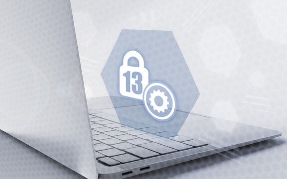 Digital safety settings and parental controls concept featuring a secure lock icon with number thirteen and gear on laptop computer background for cybersecurity and protection.