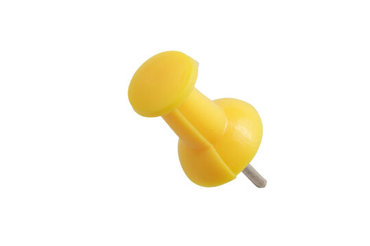 Studio macro shot of single yellow plastic push pin with metallic needle lying flat. Direct top view with soft even diffused lighting on isolated transparent background.