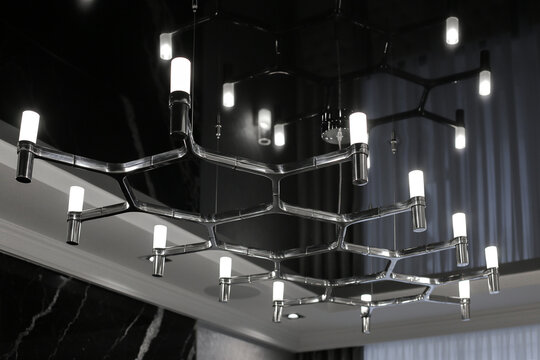 Luxury ceiling chandelier in apartment