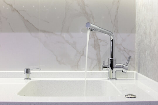 Running kitchen faucet in apartment