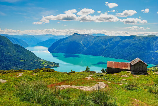 Panoramic view of Lustrafjorden with traditional mountain farm in Norway