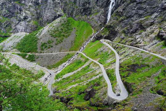 Winding Trollstigen mountain road and waterfalls in Norway