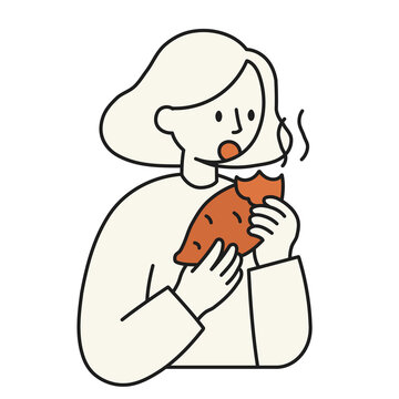 焼き芋を食べる女性