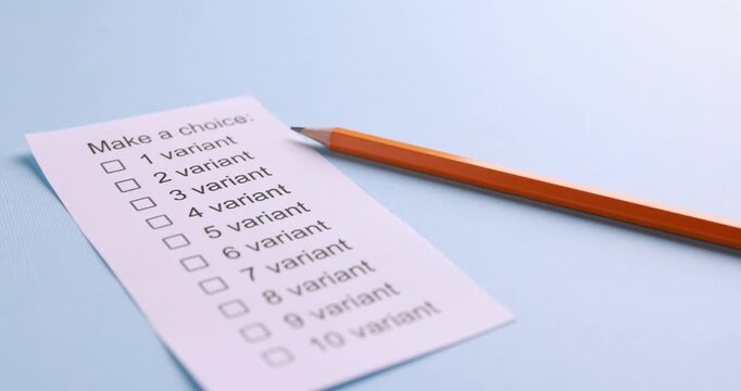 Paper sheet with phrase Make a choice and list of variants with pencil on light blue background, closeup. Camera moving right