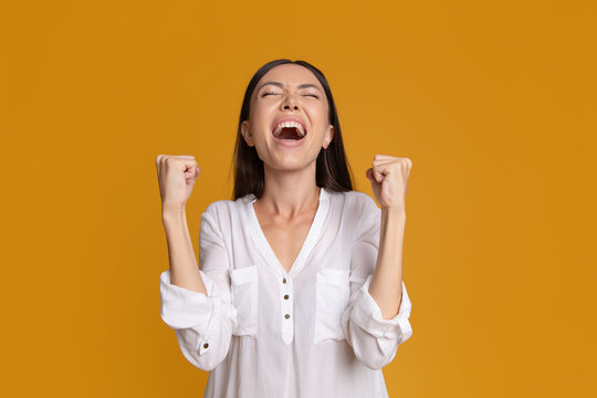Overjoyed woman cheering after achieving success