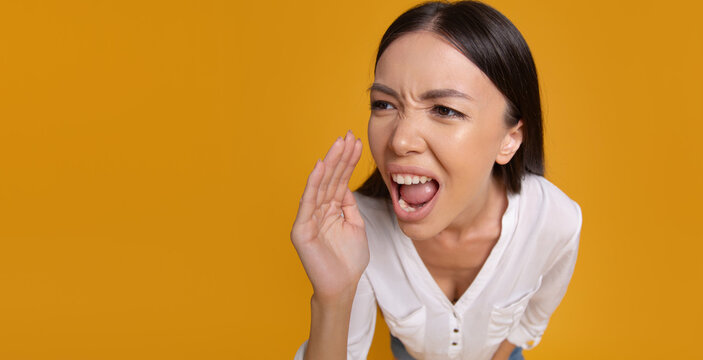 Woman shouting announcement toward large copy space