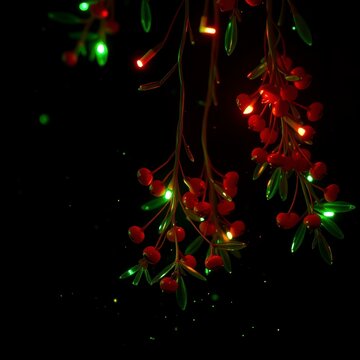 Christmas holly berries with glowing fairy lights on dark background