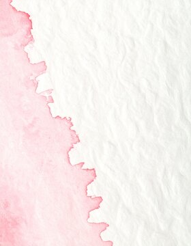 Soft blush pink pigment bleeding into warm ivory handmade paper, delicate abstract background