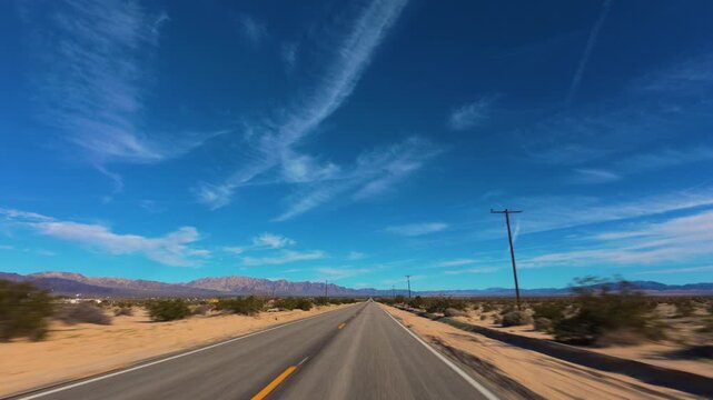 Mojave Desert POV Drive on Straight Road Through Open Landscape