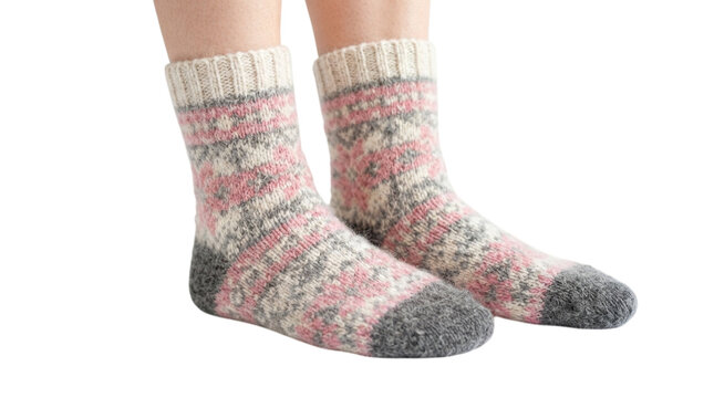 A pair of cozy wool socks with a traditional nordic pattern in pink, grey, and cream colors isolated on transparent background