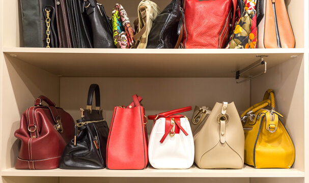 collection of handbags in woman`s closet