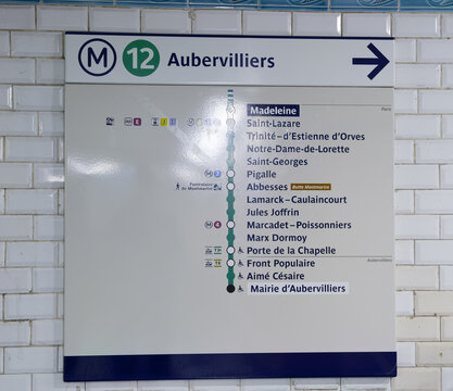 PARIS, FRANCE - SEPTEMBER 1, 2026 - Paris Metro sign displaying the Line 12 route to Mairie d'Aubervilliers with station names
