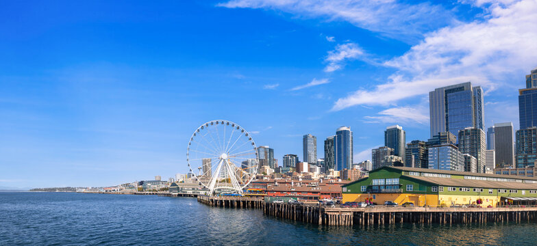 Scenic view of the Seattle waterfront on Elliott Bay featuring the giant wheel and downtown skyline in Washington state