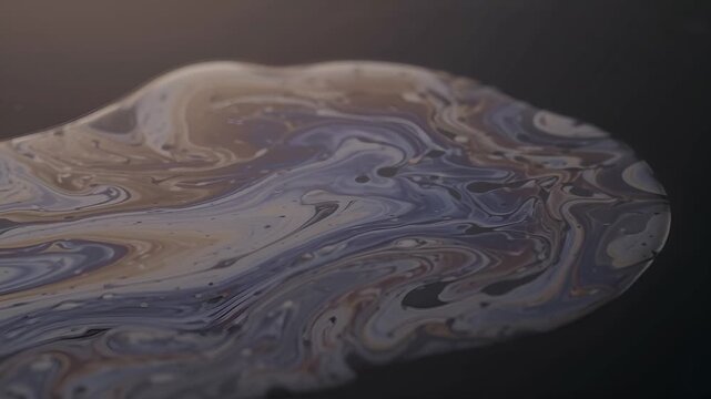 Abstract Macro Pattern of Swirling Iridescent Oil Film and Liquid Reflection on Dark Surface