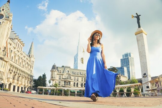 Batumi, Georgia - 7th august, 2025: Elegant excited happy woman sightseeing europe square, visiting Batumi Georgia. Tourists enjoying holiday in Europe famous landmark - Vacation and happy lifestyle