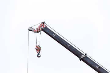 Construction crane isolated on withe background © Maria