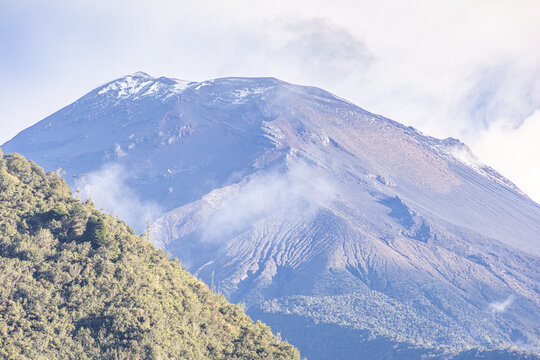 The majestic Tungurahua volcano (5,023 meters above sea level) seen from the town of Ba&ntilde;os de Agua Santa, Ecuador.