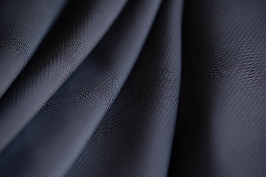 Fondo de textura de tela chif&oacute;n en color azul marino oscuro con pliegues suaves.