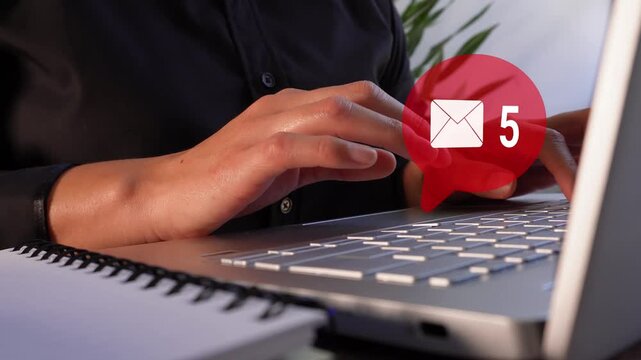 Close-up of female hands typing on a laptop, featuring an animation of an incoming message or email notification with a counter.