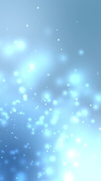 Abstract glowing particles float in soft blue gradient