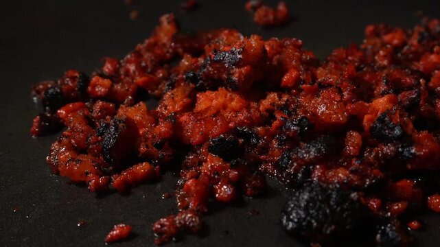 Close-up of seared, crumbly chorizo with glossy red-brown crust