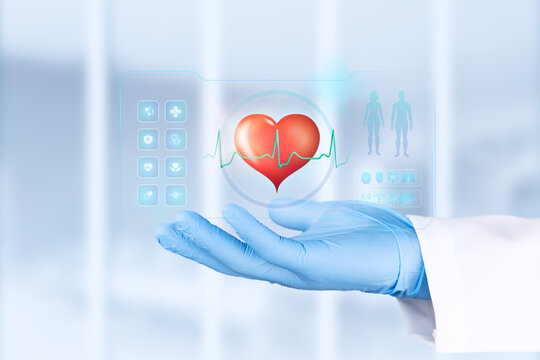 A doctor's hand, gloved in light blue, holds a graphic with a heart icon. Concept of health, prevention, and medical care. Bokeh background. Isolated.