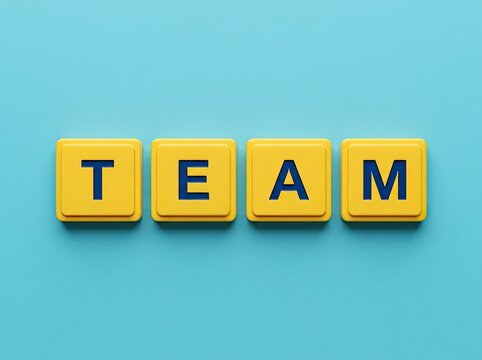 Yellow letter blocks spelling TEAM on blue surface ideal for business branding representing unity collaboration and collective success