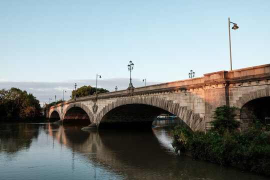 Kew bridge spanning river thames at twilight hour