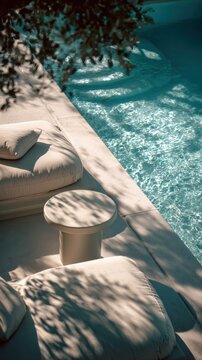 Modern Poolside Seating with Cushioned Loungers and Clear Water