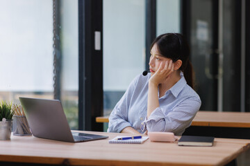 Fototapeta premium Bored customer service agent working in call center