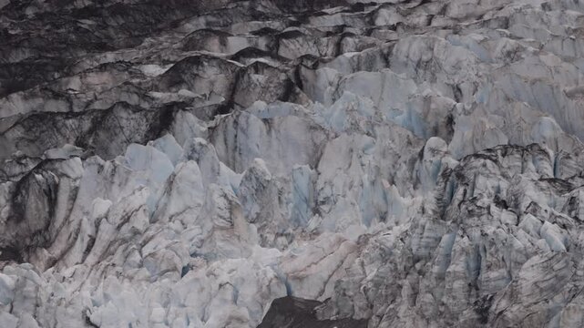 a tilt up close shot of lamplugh glacier at glacier bay, alaska of the usa