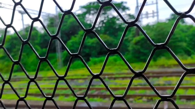 beautiful scenery through the window of the local train in the mumbai city in rainy season.