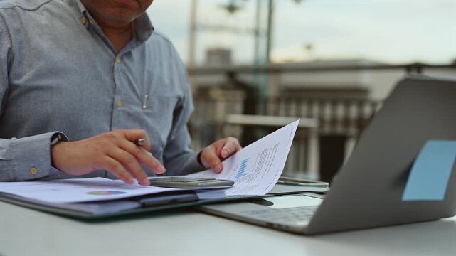 Businessman performs market analysis, targeting investment strategy, completing data analysis, evaluating investment portfolio risk, finishing detailed document analysis.