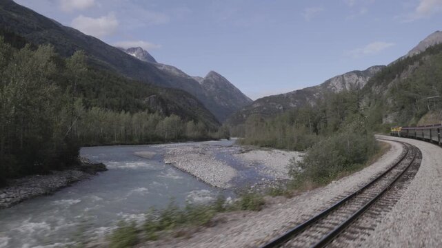 a view of skagway river from the white pass & yukon route railway at skagway, alaska of the usa