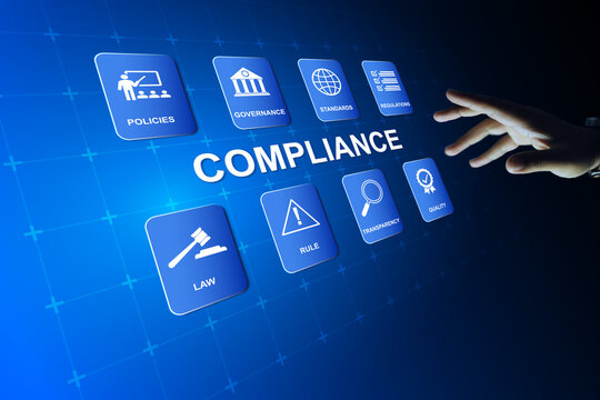 compliance concept with hand reach out to touch compliance interface represents implemented on work system to meet on standards regulation requirement
