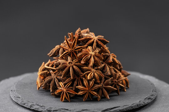 star anise, badian seeds or Illicium verum on a black slate stone tray