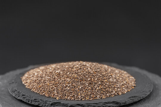 chia seeds salvia hispanica plants on a black slate stone tray