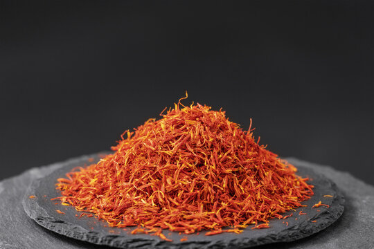 flowers safflower on a black slate stone tray