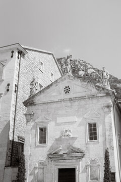 St. Mark's Church facade with statues and mountain backdrop