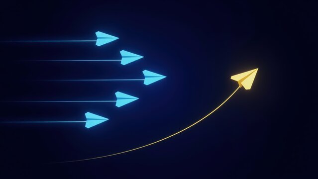 A single yellow paper airplane changing direction away from a group of blue planes on a dark background. Concept of leadership and innovation.