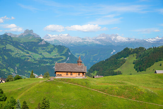 view from above to chapel Maria Hilf. car-free tourist resort Stoos, swiss alps range