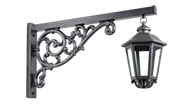 Decorative black metal wall bracket with an ornate scrollwork and a hanging hexagonal glass lantern isolated on a transparent background