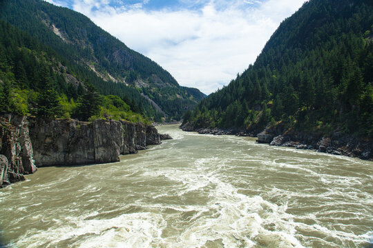 Rapids flowing through a narrow gorge at Hell's Gate on the Fraser River, British Columbia, Canada
