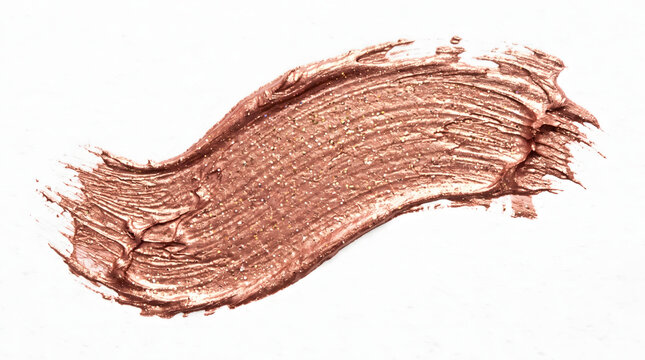A luxurious shimmering rose gold metallic makeup swatch isolated on a clean white background showcasing a beautiful textured brushstroke perfect for beauty product advertisements cosmetic