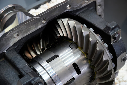 Close-up of the gear wheel of a large industrial gearbox. Sample of agricultural machinery. Selective focus.